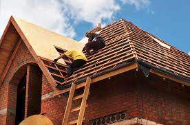  Professional Roof Experts inspecting and repairing your roof